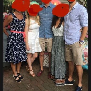 Black with polka dots , dress with pockets and zipper in the back.